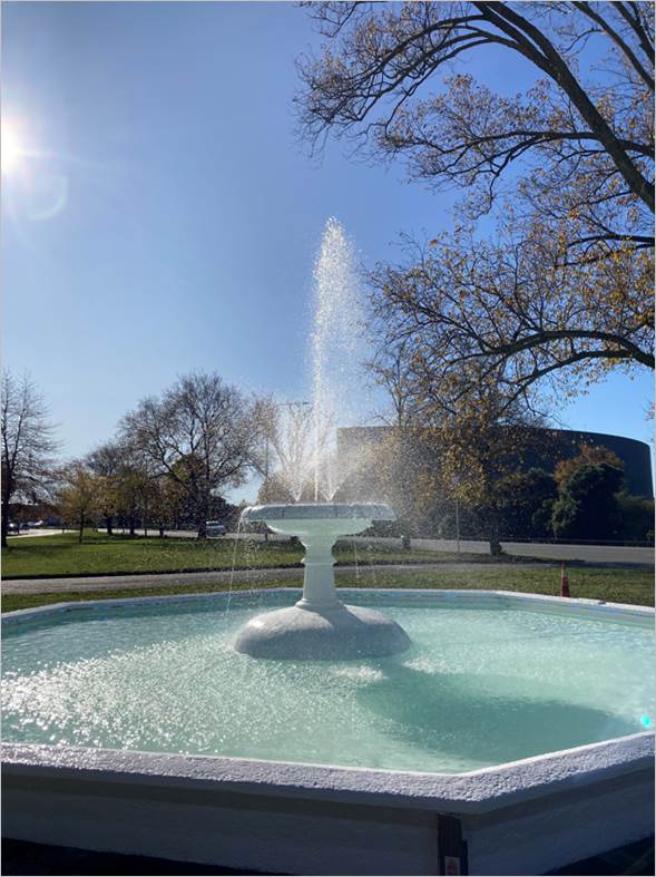 A fountain in a park

Description automatically generated with low confidence